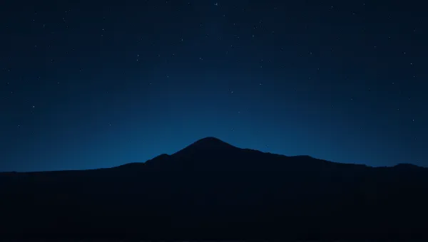 Twinkling Sky Above Shadowy Ridge Landscape