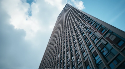 Upward Perspective Of Ornate Facade And Clouds