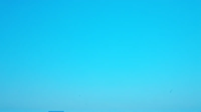 Vast Cerulean Sky Above Silhouetted Horizon