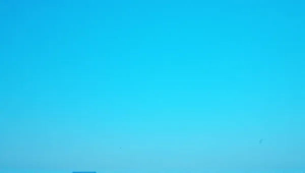 Vast Cerulean Sky Above Silhouetted Horizon