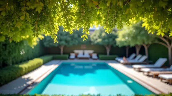 Vibrant Tree Canopy Near Modern Poolside Seating