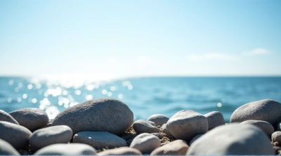 Weathered Stones Near Shimmering Water Edge