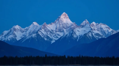 White-Capped Peaks Against Blue Twilight Sky