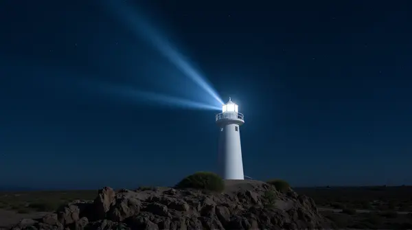 A solitary white light tower on rocky promontory with starry sky and its beam cutting through darkness.