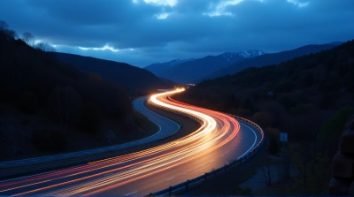 Winding Highway Light Trails At Dusk