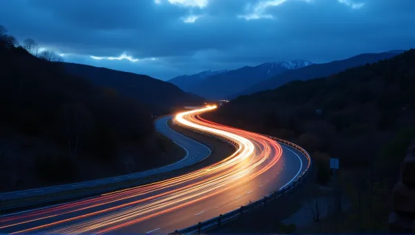 Winding Highway Light Trails At Dusk