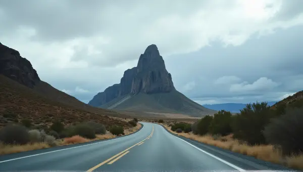 Winding Highway Toward Towering Rocky Peak