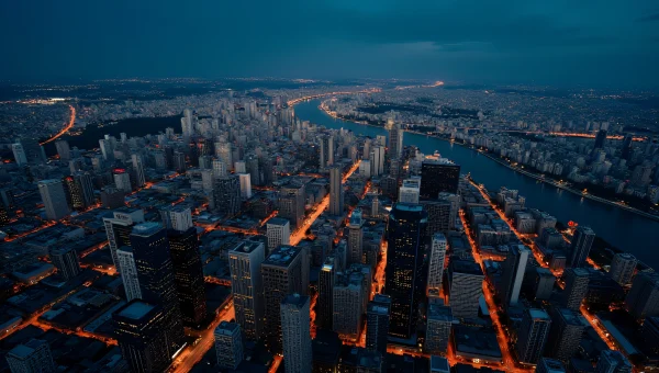 Aerial Night Cityscape With River And High-Rises