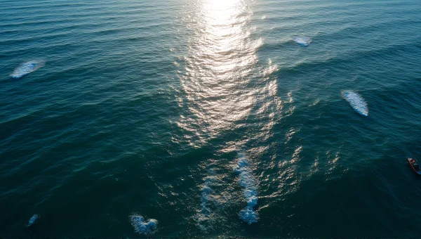 Aerial Ocean View With Waves And Fishing Boat