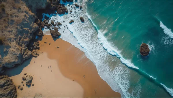 Aerial View Of Rocky Seashore With Waves