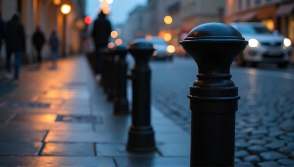 Black Metal Bollards Wet Cobblestone Street Dusk
