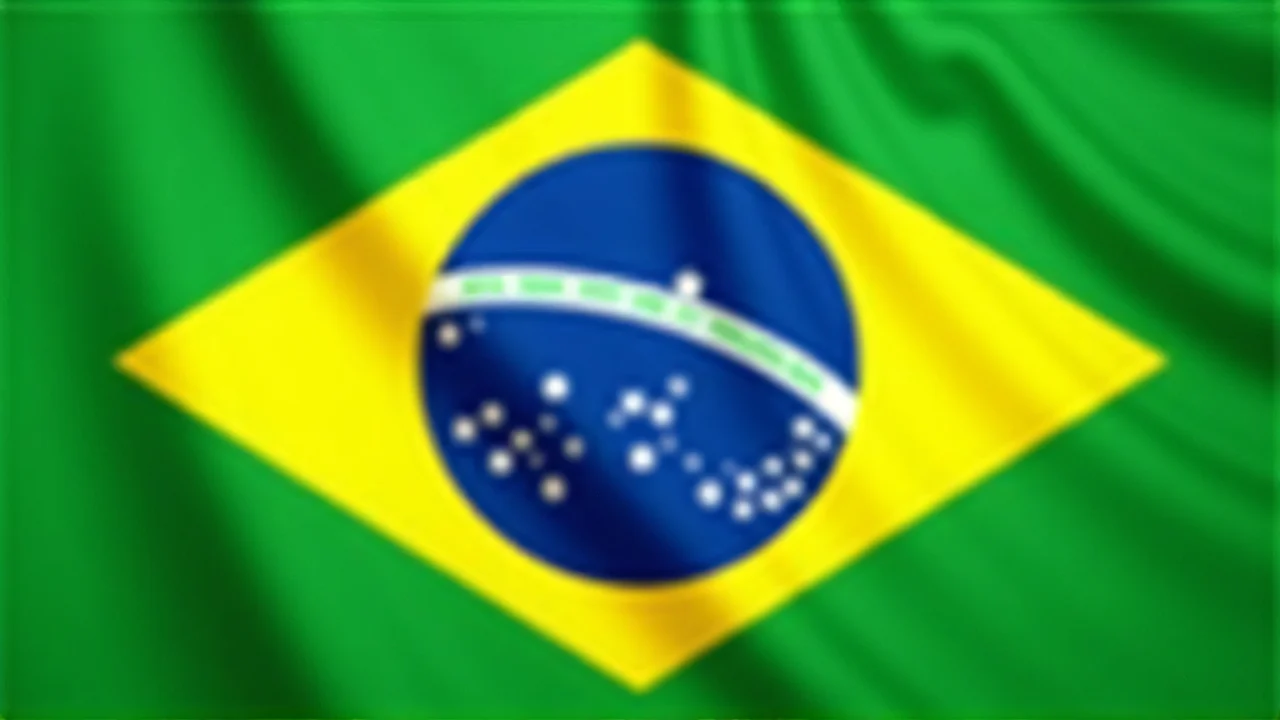 Silk texture of the Brazilian flag with a diagonal perspective in natural light.