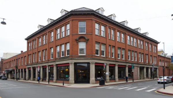 Brown Brick Building With Symmetrical Windows