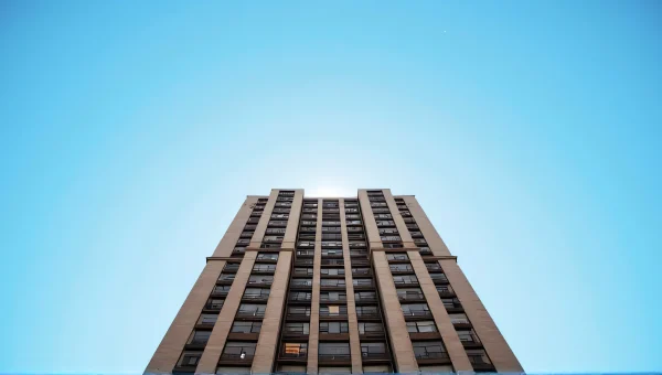 Brown High-Rise Building Against Clear Blue Sky