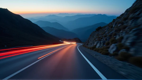 Car Speeding on Winding Mountain Road at Dusk