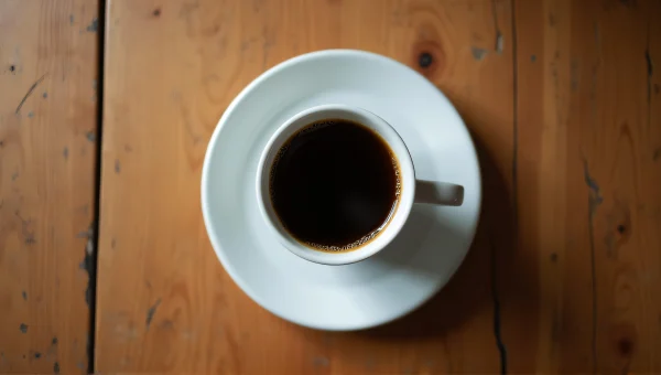 Ceramic Coffee Cup And Plate On Wooden Table
