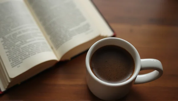 Ceramic Mug With Coffee Next To Open Book