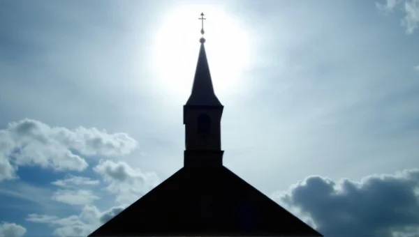 Church Belfry Silhouette Against Cloudy Sky