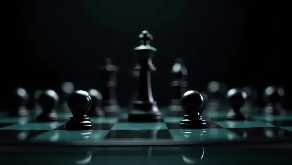 Close-Up Black Chess Pieces On Glass Board