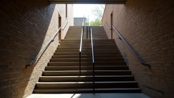 Concrete Stairway Between Weathered Brick Walls