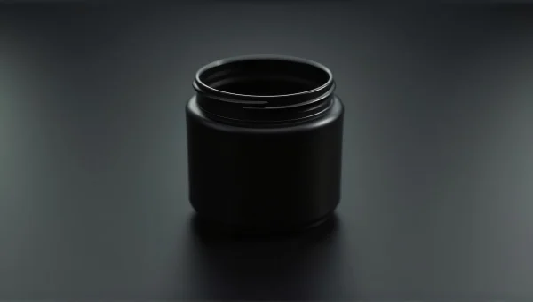 Cylindrical Black Container On Matte Surface