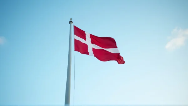 Danish Flag Low-Angle View Against Blue Sky