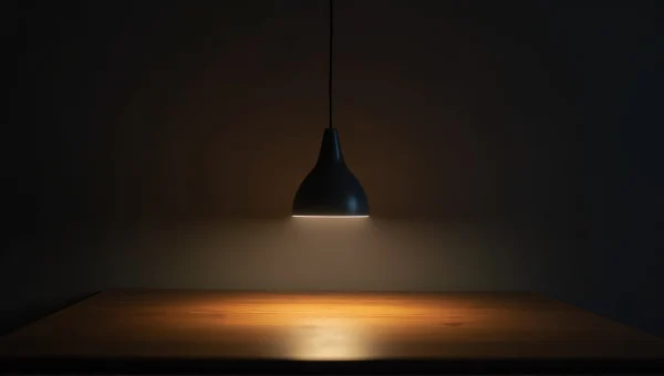 Dim Room With Pendant Lamp Over Wooden Table