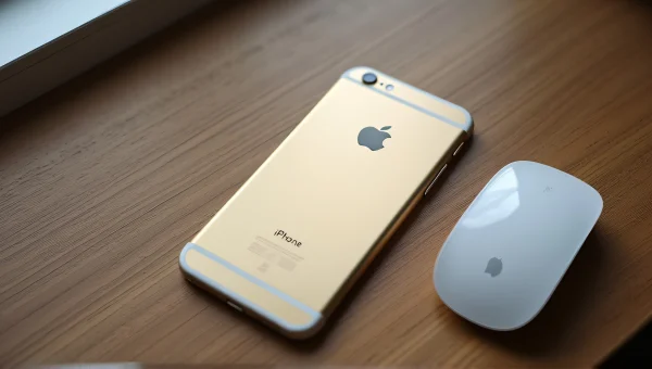 Gold iPhone 6 And Apple Magic Mouse On Desk