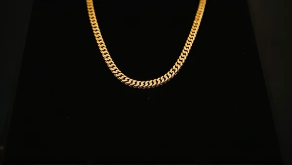Gold Necklace Close-Up On Black Velvet Background