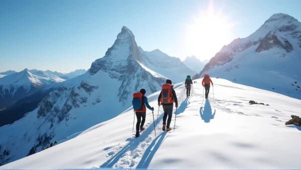 Hikers Crossing Snowy Mountain Ridge at Midday