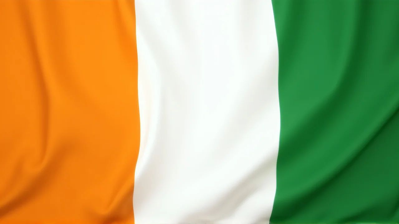 High-resolution Ivory Coast flag displayed on a textured fabric backdrop.