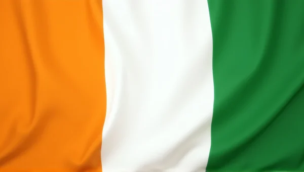 Ivory Coast Flag On Fabric Backdrop With Folds