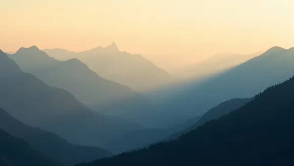 Layered Mountain Ranges at Dawn with Mist
