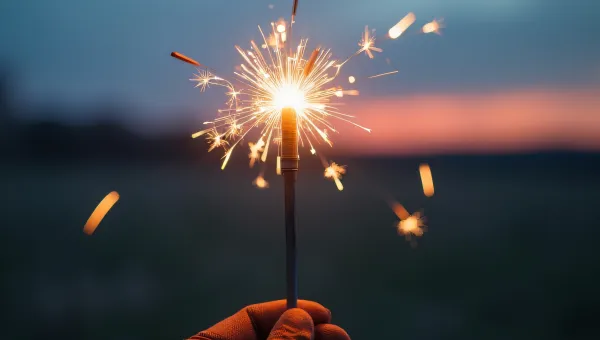 Lit Sparkler Close-Up Gloved Hand Evening Sky