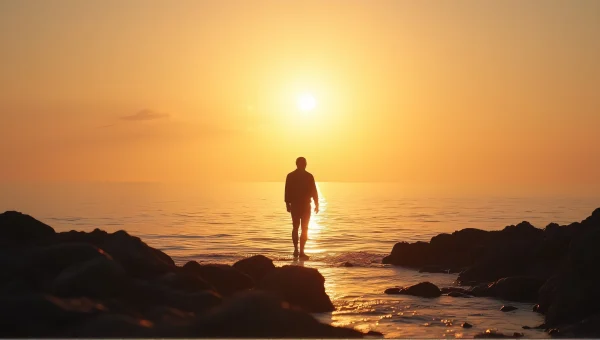 Lone Figure on Rocky Shore at Sunrise