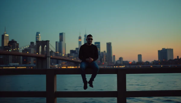 Lone Man Sitting on Bridge at Dusk Skyline