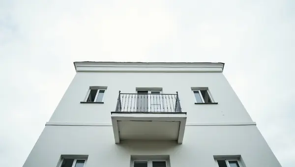 Modern White Concrete Building With Balcony