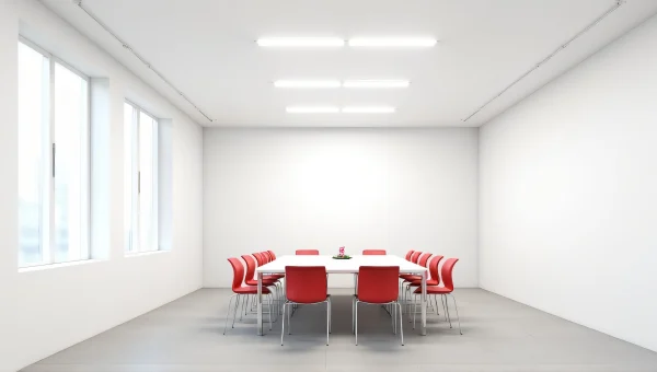 Modern White Room With Long Table And Red Chairs