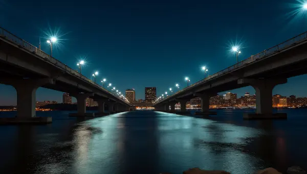 Nighttime Concrete Bridge With Reflective River View