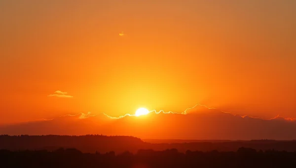 Orange Clouds Sunset Over Distant Treeline