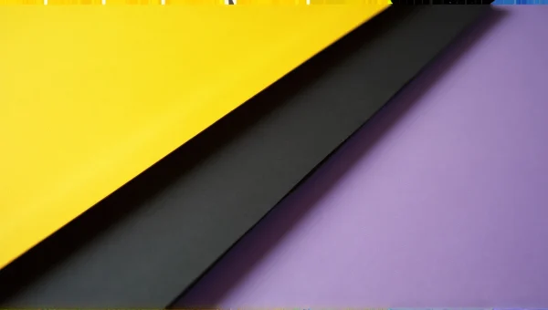 Overlapping Yellow Black Purple Paper Sheets