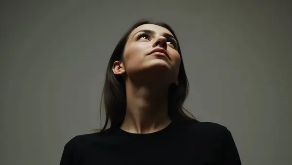 Person Looking Up In Black Crew-Neck Top