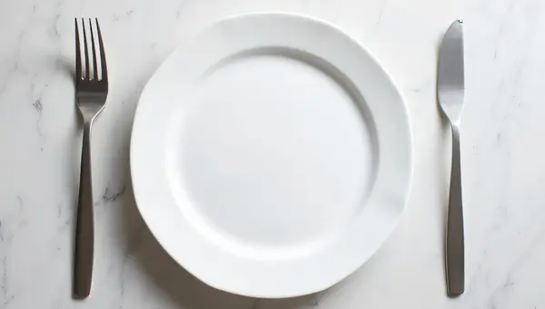 Porcelain Plate And Stainless Forks Arrangement
