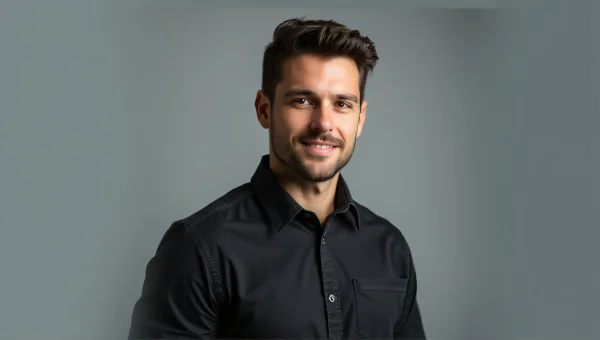 Professional Male Headshot Against Soft Gray Backdrop