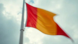 Red And Yellow Flag Waving Under Cloudy Sky