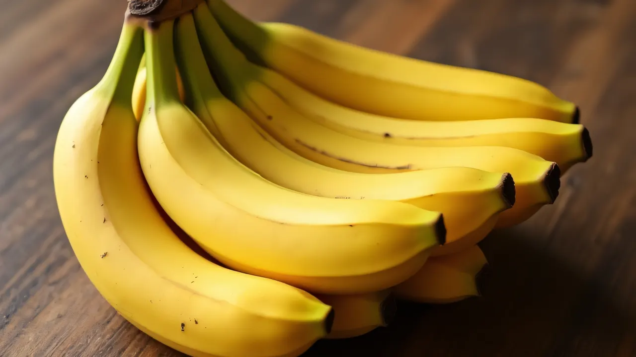 Close-up of ripe bananas arranged on a wooden table.