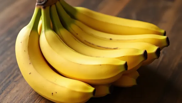 Ripe Bananas Cluster On Wooden Table Surface
