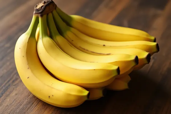 Ripe Bananas Cluster On Wooden Table Surface