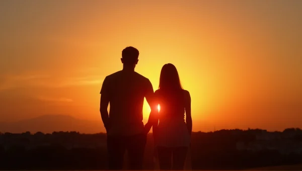 Silhouette Couple at Dusk with Soft Lens Flare