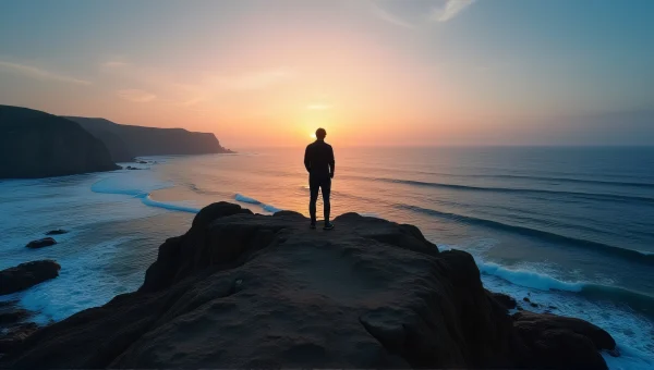 Silhouette Figure on Cliff Overlooking Sea